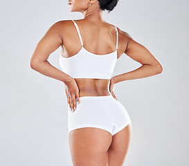 Image showing Body, wellness and back of woman after fitness exercise, workout and training to lose weight in studio. Motivation, self care and female model for cellulite treatment, diet and healthy lifestyle