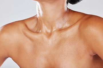 Image showing Woman neck sweating due to exercise with wet skin as water drip on a female body isolated in studio white background. Shower, model and active person chest with liquid drops due to sports