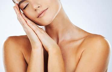 Image showing Skincare, beauty and soft skin of woman in studio for natural glow cosmetic product. Aesthetic model person with hands on face for dermatology, wellness and self care with spa treatment results