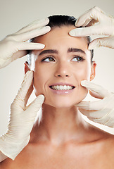 Image showing Beauty, plastic surgery and filler on face of woman with collagen dermatology cosmetics. Headshot of a skincare model with professional hands for medical procedure on facial skin and grey background