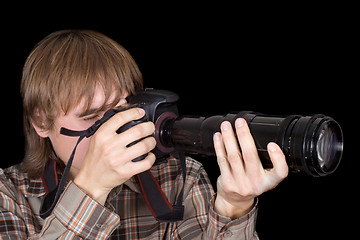 Image showing Photographer with the camera with a zoom lens