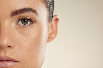 Image showing Beauty, skincare and half face of woman on mockup space for cosmetics, makeup and facial products. Spa aesthetic, dermatology and portrait of girl with glowing skin, self care and wellness in studio