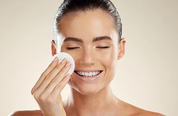 Image showing Beauty, skincare and face of woman with cotton for cleaning skin with natural dermatology product. Aesthetic model person happy about makeup remover, facial cosmetics and detox for self care results