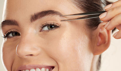 Image showing Face, beauty and woman portrait with tweezer for eyebrow cleaning or hair removal in studio. Happy aesthetic model with a smile for facial, cosmetic tools and clean skin for self care routine