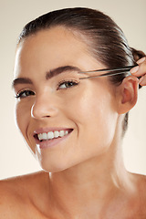 Image showing Beauty, face and woman portrait with tweezer for eyebrow cleaning or hair removal in studio. Happy aesthetic model with a smile for facial, cosmetic tools and clean skin for self care routine