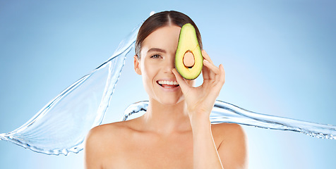 Image showing Skincare, beauty and woman portrait with avocado for natural skin dermatology cosmetic product. Water splash and face of aesthetic model in studio for sustainable self care for health and wellness