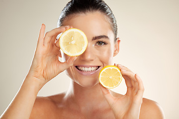 Image showing Skincare, face portrait and happy woman with lemon for natural fruit detox, health wellness or facial beauty glow. Spa salon, dermatology healthcare and nutritionist model with vitamin c food product