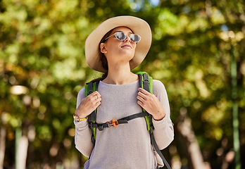 Image showing Hiking, woman thinking and adventure, outdoor and walking for wellness, fitness and break. Happiness, female tourist and lady in nature, travel and getaway for calm, healthy lifestyle and tourism