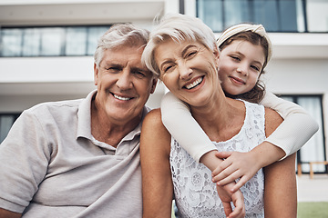 Image showing Portrait, girl and grandparents relax in real estate, new home and backyard, hug and happy while bonding. Face, grandchild and senior man and woman enjoy property, retirement and embrace in a garden