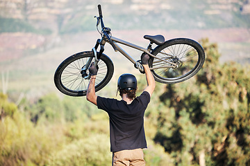 Image showing Bicycle, athlete and outdoor and sports athlete with fitness and cycling sport on mountains. Energy, moving speed and freedom with a bike in the air doing a fast road race with trees and helmet