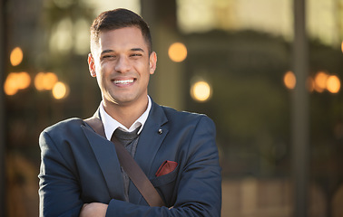 Image showing Young businessman, happy and portrait in urban city standing crossed arms for success, positive mindset and happiness. Corporate man, smile and confident face for business achievement in cityscape