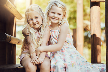 Image showing Portrait, children and girl siblings outdoor together at a park during summer vacation or holiday. Family, kids and love with a female child and sister hugging while bonding outside or having fun