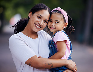 Image showing Portrait, mother and kid hug in park, fun day outdoor with love and care, happy people together in nature. Family, happiness and bonding with childhood, woman and girl are content with smile