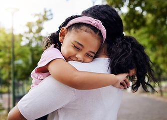 Image showing Hug, park and mother and daughter, love and sweet while bonding outdoor together. Black woman, embrace and fun in a forest, precious and happy, content and relax in a beautiful moment of motherhood