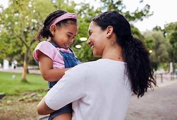 Image showing Happy, family and mother with daughter in a park, laughing and playing while bonding outdoor together. Love, black woman and girl embracing in a forest, sweet and caring, relax and smile for joke