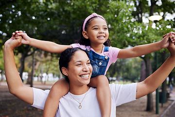 Image showing Nature, mother with girl on shoulder and outdoor for happiness, loving and excited for quality time together, weekend and summer. Child, mom and female kid and in park for bonding, smile and walking