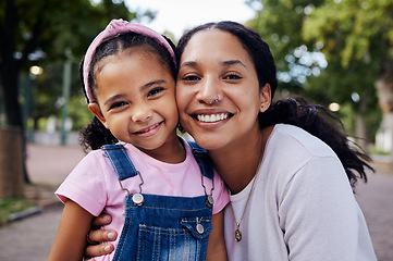 Image showing Family, face and mom with kid in park, portrait with hug and fun day outdoor, love and care in nature with happy people. Smile, happiness and adventure with woman and girl bonding with childhood