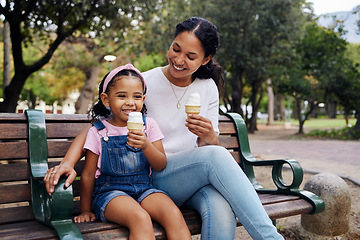 Image showing Black family, park and ice cream with a mother and daughter bonding together while sitting on a bench outdoor in nature. Summer, children and garden with a woman and girl enjoying a sweet snack