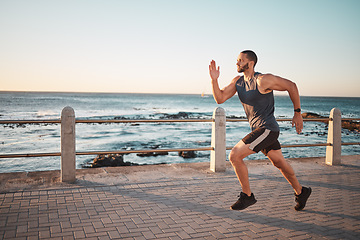 Image showing Running, ocean and mockup with a man runner training outdoor on the promenade for cardio or endurance. Fitness, sea and mock with a sports male taking a run on the coast for health or wellness