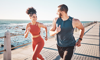 Image showing Running, exercise and training with a sports couple outdoor in summer for a cardio or endurance workout. Health, fitness and ocean with a man and woman runner on a promenade for a challenge together