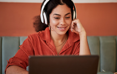 Image showing Headphones, restaurant and black woman with laptop streaming a video or podcast on computer. Student web learning, watching or radio listening of a happy young person at a coffee shop ready for study