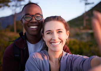 Image showing Nature, selfie and portrait of interracial couple on mountain for holiday, vacation and hiking adventure on weekend. Travel, wellness and happy man with woman enjoy calm, freedom and peace at sunset