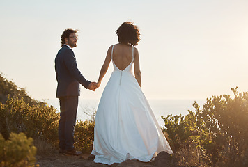 Image showing Love, wedding and holding hands with couple in nature park for celebration, romance and happiness. Sunset, support and summer with bride and groom in countryside for marriage, ceremony and bonding