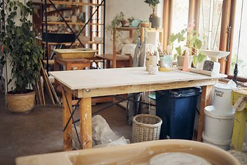 Image showing Creative, art and pottery with empty room of workshop for design, manufacturing and small business. Ceramics, interior and production with table in studio of for painting, inspiration and retail