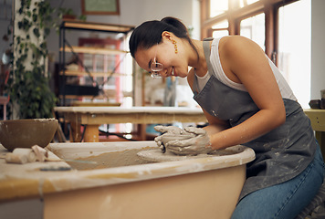 Image showing Pottery wheel, workshop and startup business woman manufacturing creative art product with hands. Happy asian potter artist working in clay or ceramics retail industry, studio or class with pride