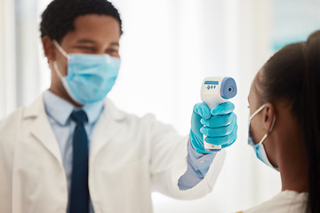 Image showing Doctor, patient or thermometer in covid check, hospital compliance or healthcare wellness control in clinic. Black woman, face mask or forehead fever temperature for virus management or medical help