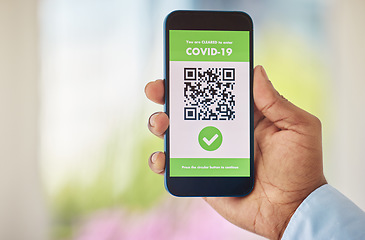 Image showing Coronavirus, vaccine and mobile certificate for travel, trip or medical certification on a phone. Technology, healthcare and closeup of hand with app for covid with barcode for immunity vaccination.