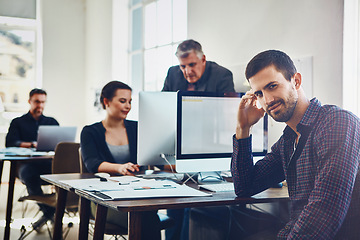 Image showing Office, portrait and business man by computer in company workplace. Coworking, planning and happy male employee working on marketing report, advertising proposal or sales project with colleagues.