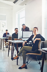 Image showing Teamwork, portrait and business woman in office workplace ready for targets or goals. Leadership, ceo and happy female manager sitting on chair with coworkers working on sales or advertising project.