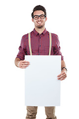 Image showing Portrait, man and billboard in studio for advertising, space or billboard branding on white background. Face, paper and mock up by handsome guy with banner, marketing and smile, happy and isolated