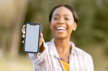 Image showing Mockup, smartphone and black woman in nature or park with happy portrait for mobile app or product placement. African person, hand holding phone and mock up screen, space and 5g technology in garden