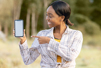 Image showing Mockup screen, phone and black woman pointing at digital marketing, branding or advertising content. Outdoor, technology and person point with happiness and online on mobile with blurred background