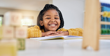 Image showing Education, child and girl writing at table for homework, lesson and home school activity in her house. Learning, student and child development, student and distance learning, smile and happy drawing