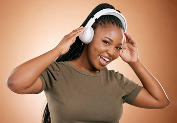 Image showing Headphones, music and black woman in portrait isolated on studio background for mental health, energy and podcast. Happy african person listening to audio technology with smile on face for sound