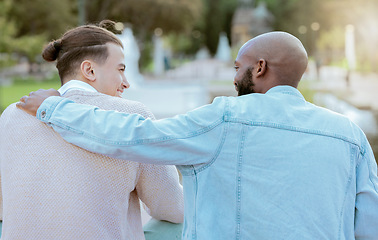 Image showing Hug, outdoor stairs and couple of friends together with happy conversation in a park. People back, smile and happiness of students talking on garden steps in summer with social communication