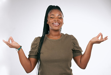 Image showing Meditation, black woman and peace in studio, smile and gratitude of trust. Happy female, zen hands and meditate on background for mindset, chakra energy and relax with yoga, wellness and healthy soul