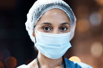 Image showing Woman, doctor and portrait with face mask in night at workplace, hospital and career vision on nightshift by window. Healthcare expert, dark clinic and focus goal with ppe, safety and stop covid 19