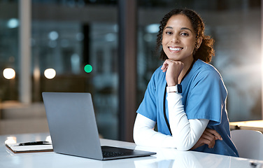 Image showing Doctor, computer and black woman portrait in a healthcare office at night working on web research. Laptop, health worker and nurse with happiness from medicine analysis on technology in the dark