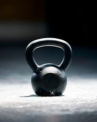 Image showing Fitness, motivation or kettlebell at a gym with mockup space for strength training, exercise or workout. Zoom, metal equipment or heavy weight for strong muscle development or growth in health club