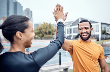 Image showing Couple of friends, laughing and high five for sports, success and team support in city. Happy athletes, fitness motivation and celebration of achievement, wellness and smile of winning exercise goals