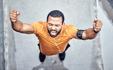 Image showing Top view, black man and achievement for exercise, outdoor and celebration for target, happiness and fitness. African American male, runner or athlete with motivation, workout or training goal in city