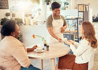 Image showing Waiter, serving and restaurant service for customer at a coffee shop or cafe with friendly worker in the morning. Beverage, consumer and man gives satisfied woman in a meeting coffee or tea