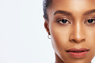 Image showing Portrait, black woman and skincare mockup in studio, white background and isolated space. Serious female model face, facial beauty and cosmetics for dermatology, aesthetic makeup and salon wellness