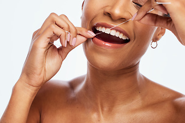 Image showing Tooth, floss and black woman face, flossing for teeth whitening, healthcare and hygiene isolated on white background. Oral care product, dental and mouth cleaning for fresh breath in studio