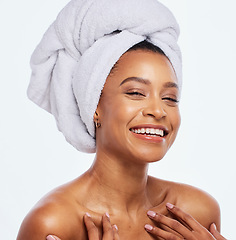 Image showing Hair care, towel and woman face portrait in studio, isolated white background and facial beauty. Female model, clean shower and head cloth for happy skincare, laughing and smile for body dermatology