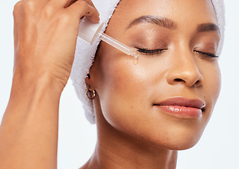 Image showing Beauty, woman and face oil for skin in studio with dermatology, cosmetics and natural skincare. Aesthetic model with collagen spa facial serum product for healthy glow isolated on a white background